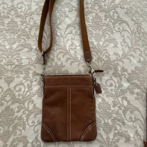Vintage Coach Swingpack crossbody bag, saddle brown.